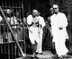 India: Mohandas Gandhi leaving a jail after meeting with political prisoners, 1938